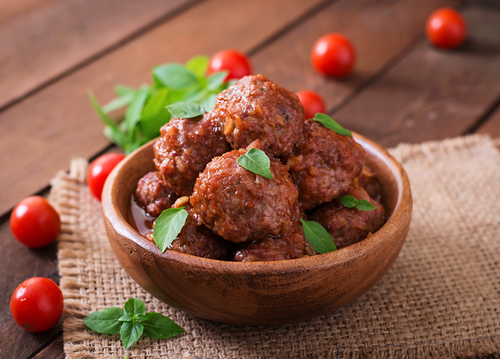 Meatballs in bowl on table