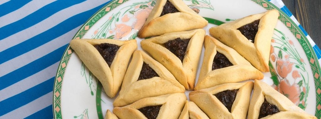 A colorful plate of hamantaschen or Haman's ears, cookies traditionally eaten on the Purim holiday.