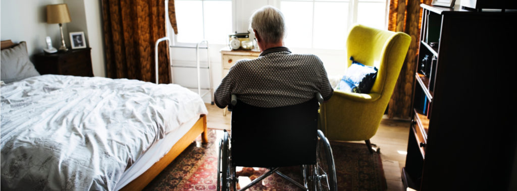 Man with back to camera sitting in wheelchair