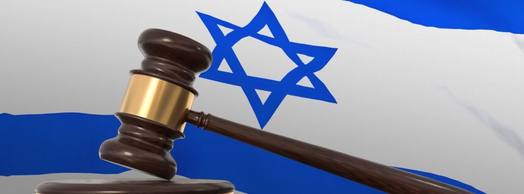 Gavel in front of Israeli flag, representing Israel's legal status.