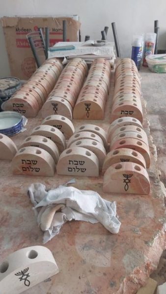 A collection of Jerusalem stone candle holders